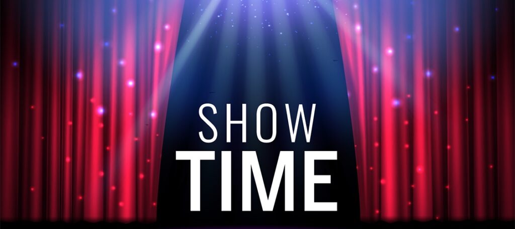 A stage with red curtains being pulled back to reveal the words "Show Time."